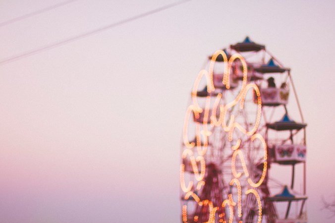 Ferris wheel, dusk pink sky, colorful carts.jpg